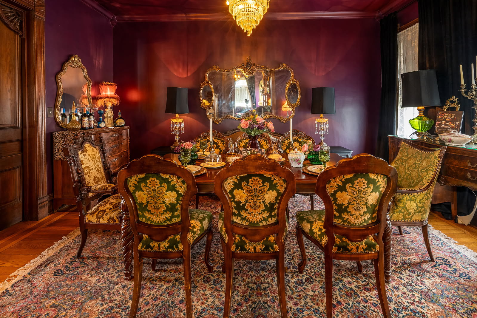 Dining room with ornate chairs and food settings