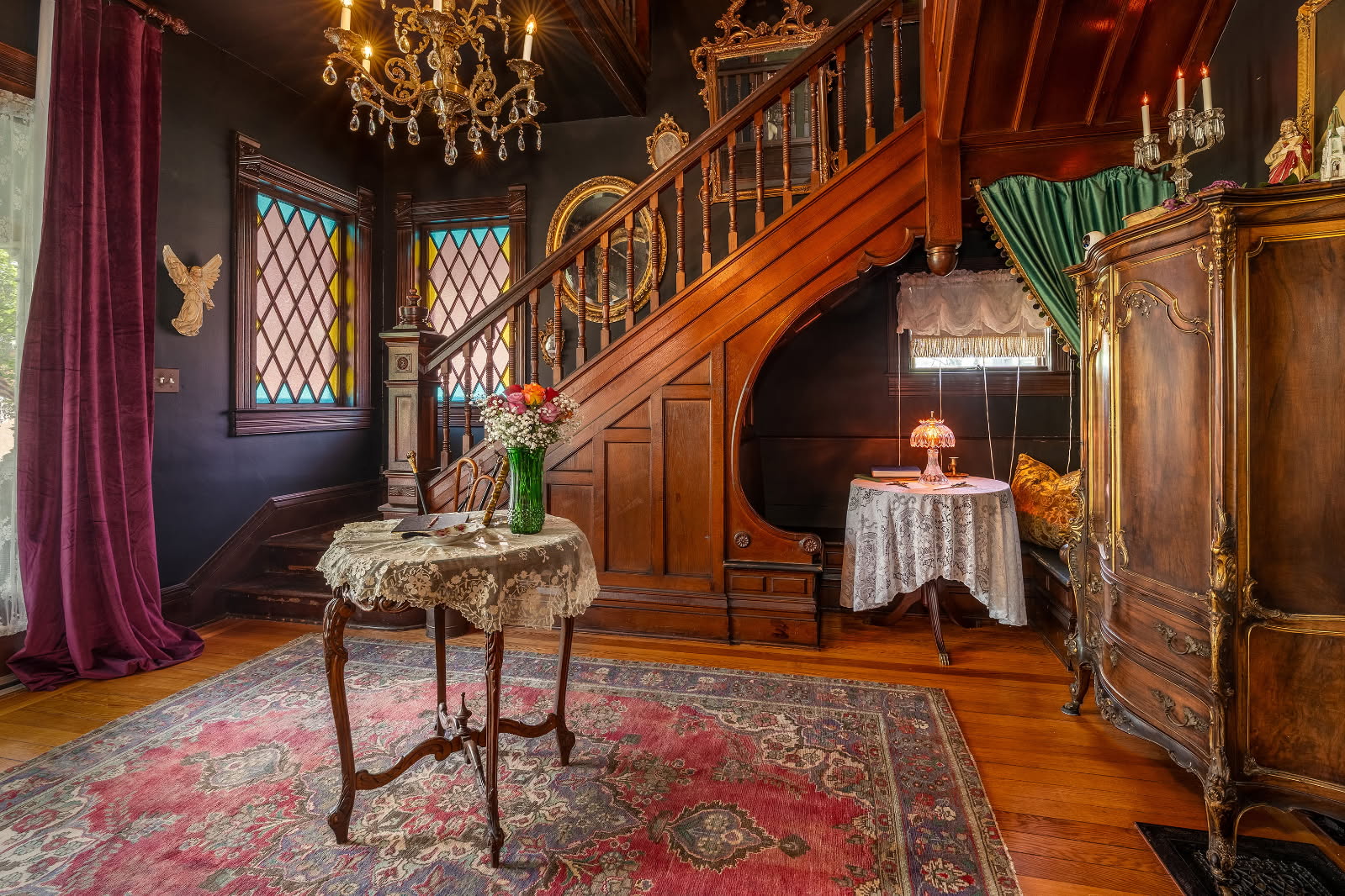 interior of home showing stairs with a nook and antique furniture